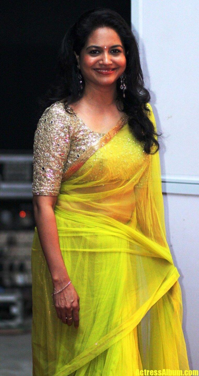 Singer Sunitha Long Hair Stills In Transparent Yellow Saree - Actress Album