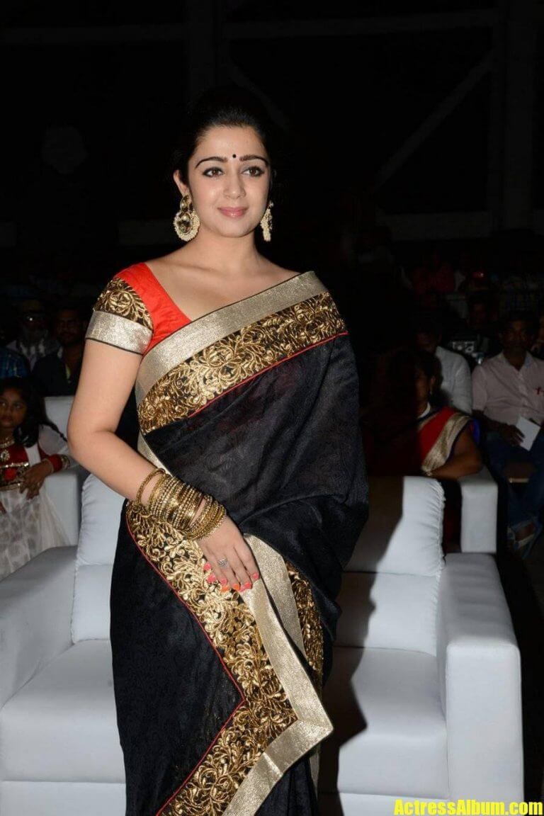 Tollywood Actress Charmy In Black Saree At Audio Launch - Actress Album