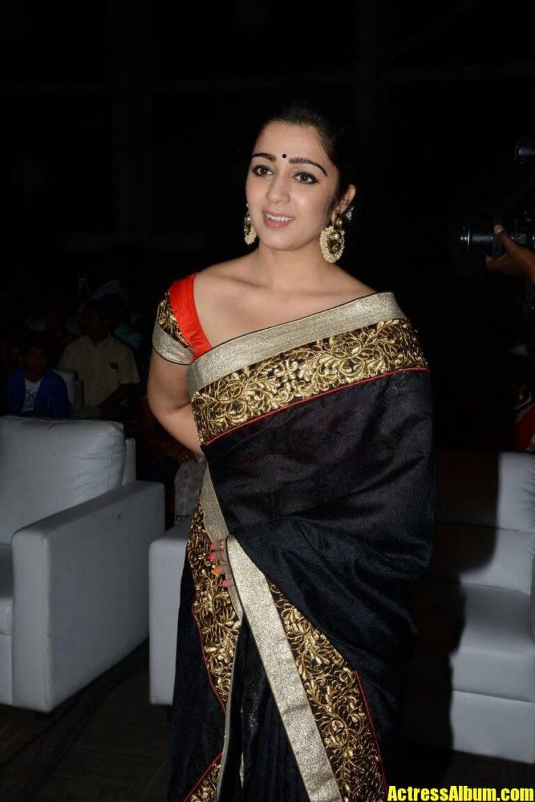 Tollywood Actress Charmy In Black Saree At Audio Launch - Actress Album