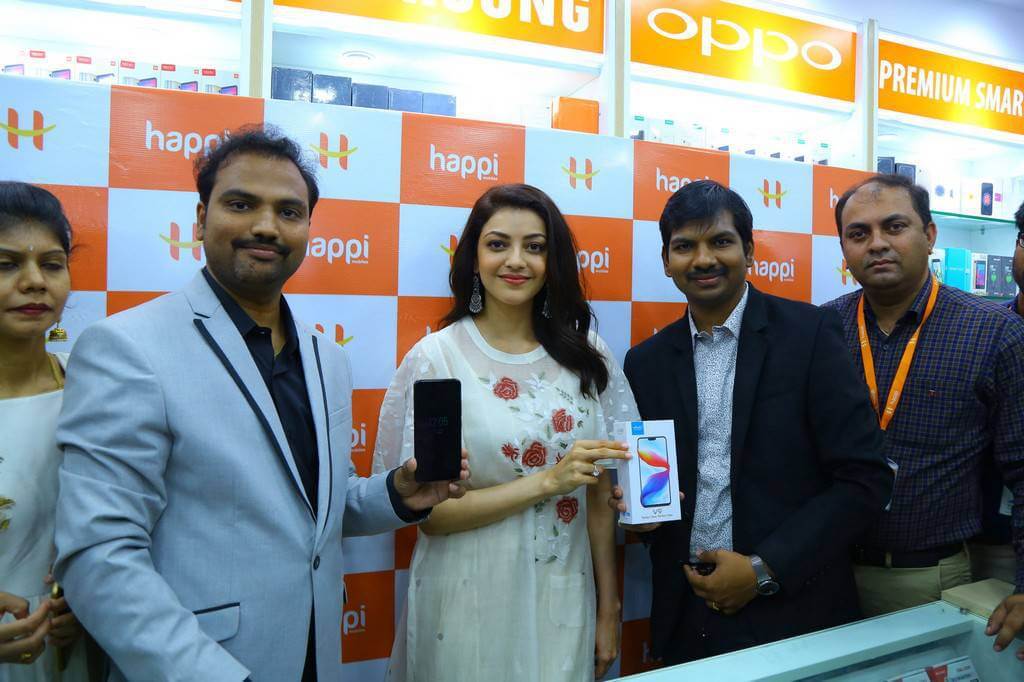 Indian Actress Kajal Agarwal In White Dress During Happi Mobiles Launch