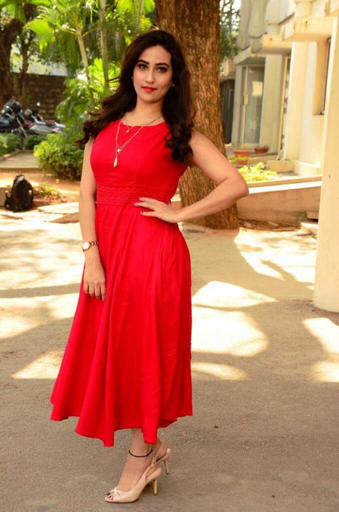 Hot Stills Of Anchor Manjusha In Red Dress