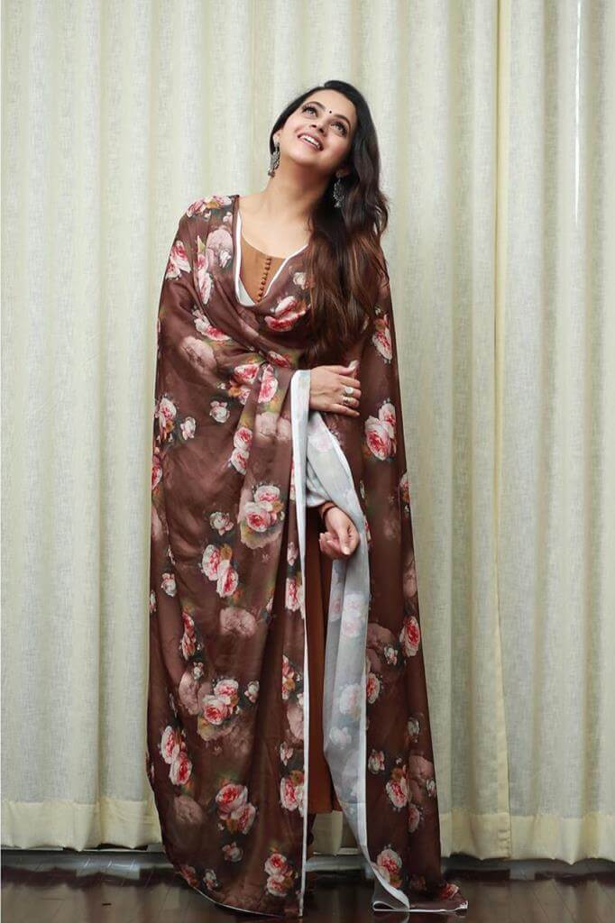 Actress Bhavana Menon In Floral Tan Churidar