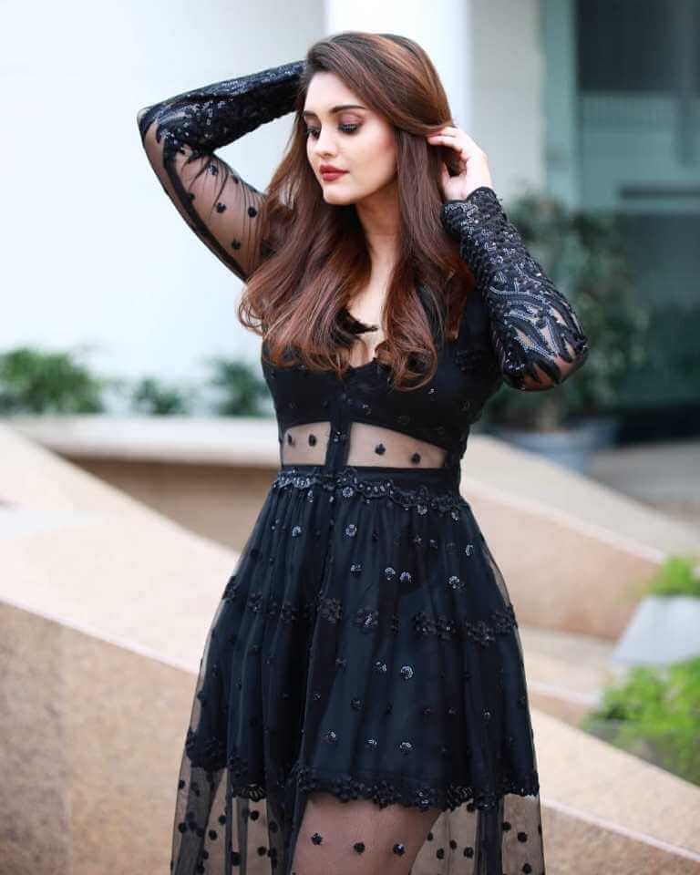 Actress Surabhi Hot Stills In Black Dress