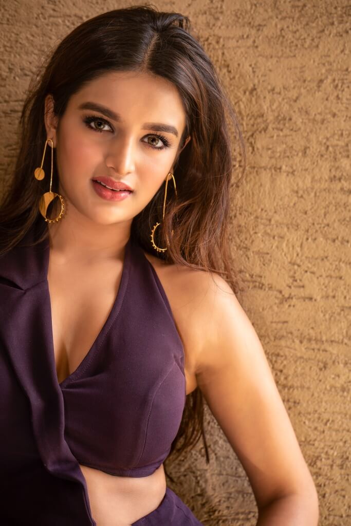 Bollywood Beauty Nidhhi Agerwal Hot Photoshoot In Violet Dress