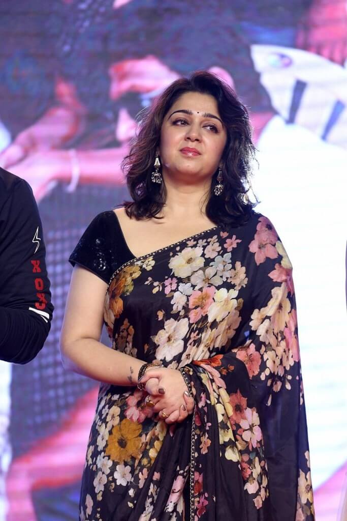 Charmy Kaur In Saree At Meeku Maathrame Cheptha Pre-Release Event